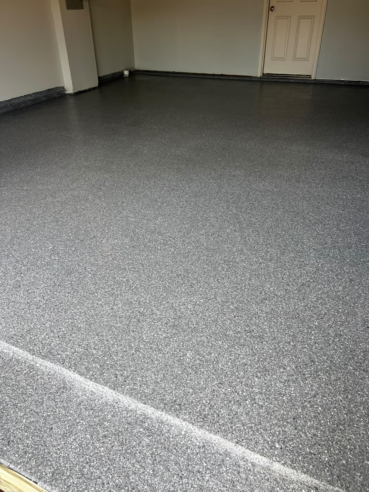 Finished garage polyaspartic flake floor, wide view